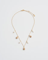 Sea Snail Charm & Pearl Worn Gold Necklace